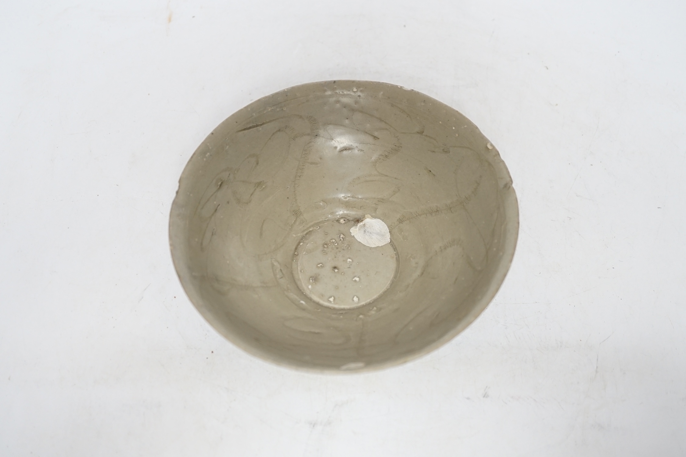 A Chinese carved shipwreck bowl, Song dynasty, 17cm diameter